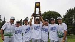 The Men's Golf team hoist the national championship trophy