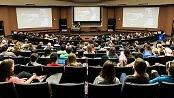 Students in a large university lecture hall