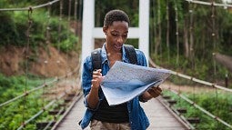 Woman hiker studying map