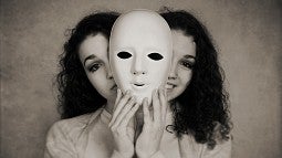 Woman holding face mask