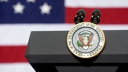 The presidential seal on a podium
