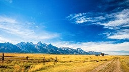 Blue skies, prairie and mountains in Wyoming