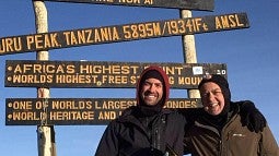 UO grad Sean Jacob Turner (left, with his father, John) sumitted Kilimanjaro, where he played 'Mighty Oregon' on a tuba
