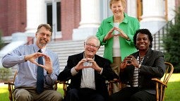 CAS interim Dean W. Andrew Marcus, Don Tykeson, Vice President for Student Life Robin Holmes (seated, from left) and Willie Tykeson