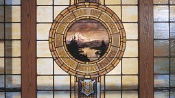 Stained glass version of the university seal