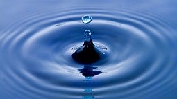 Water drop creating ripples