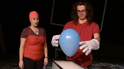 Students use a ballon in a science demonstration during rehearsals for 'Wonder if Wonder Why.'