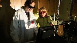 Geri Richmond with a student in the lab