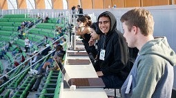 Students in press area at Hayward Field