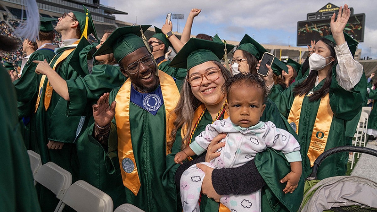 Student parent and child at commencement