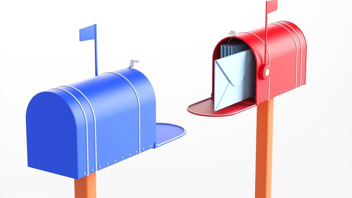 blue and red mailboxes with raised flags