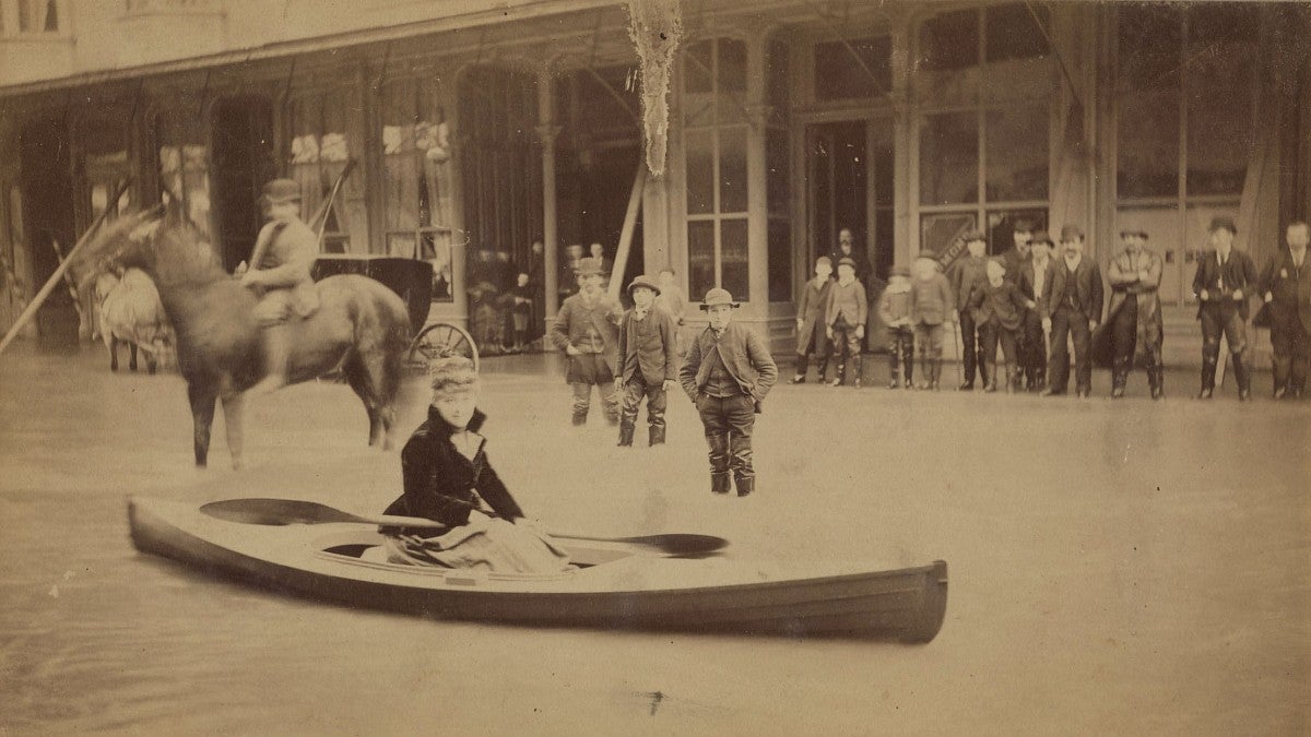 Woman in canoe during 1890 Portland flood
