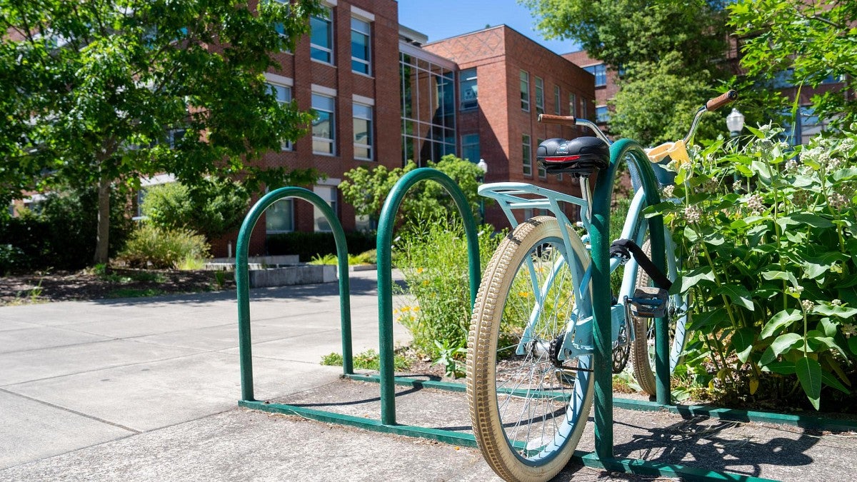 bicycle on rack in front of Allen Hall