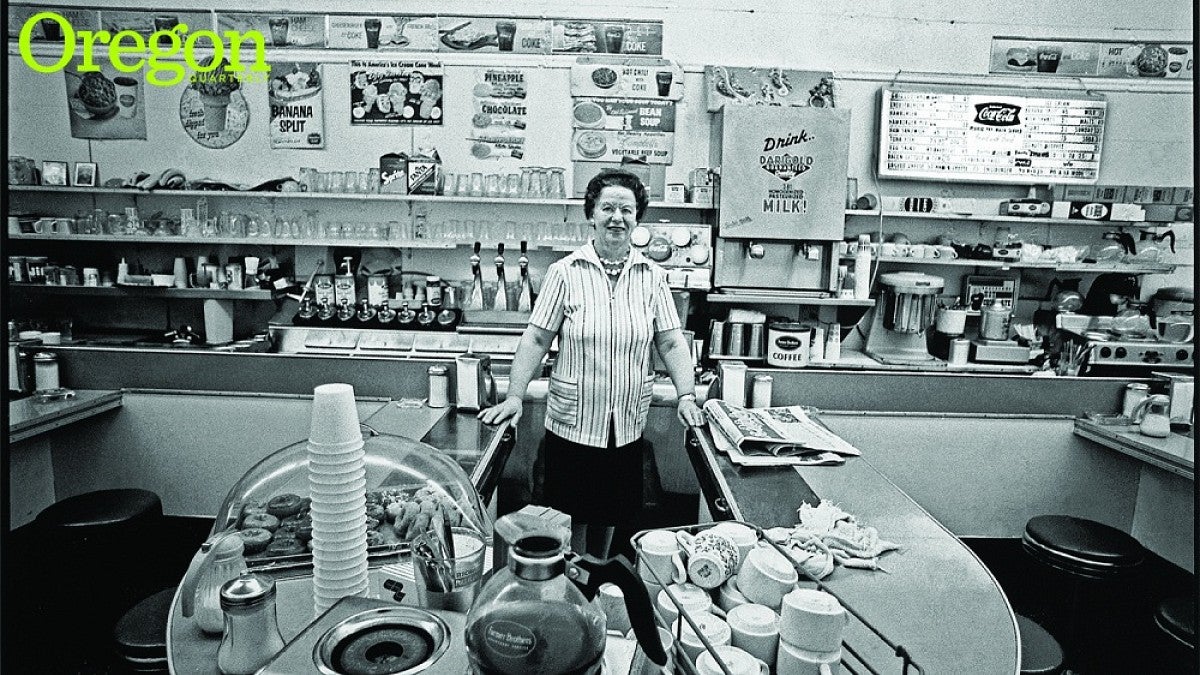 Mary Louise Pope stands at the counter of her popular ice cream and donut shop shortly before relocating her business to the suburbs. Photograph by John Bauguess