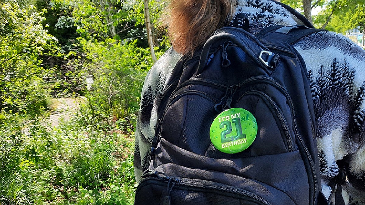 21st Birthday Project patch on backpack