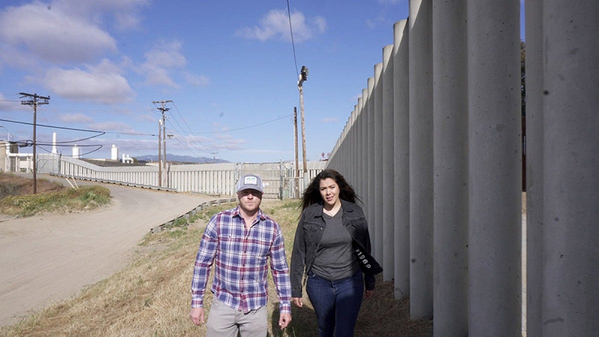Adam Markle with Jessica Solis on the Mexico border