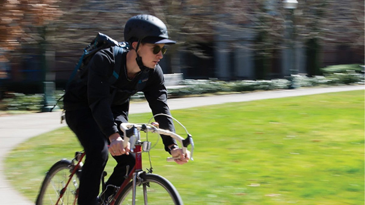 Bicyclist riding on campus