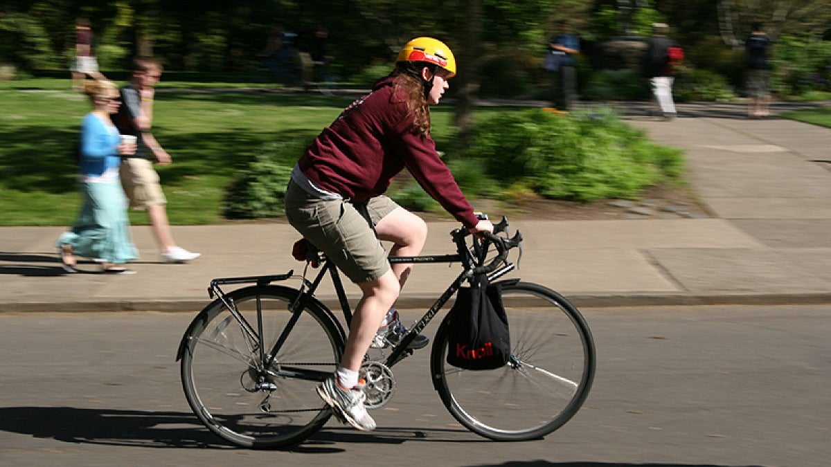 A bicyclist riding on campus