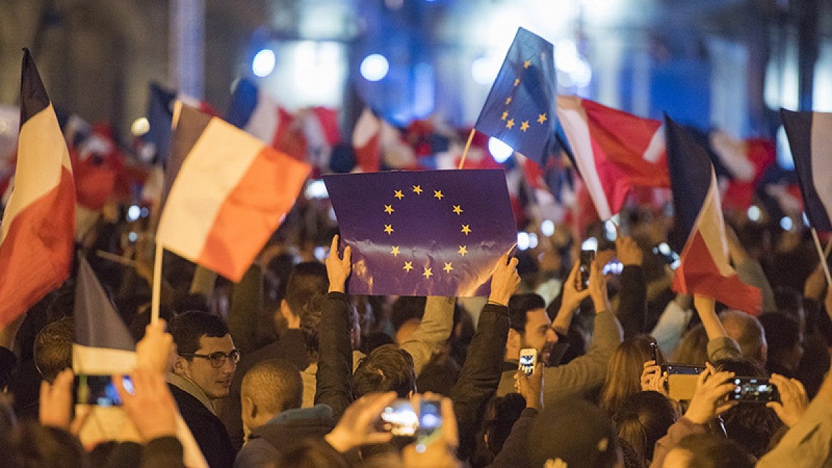French and EU flags fly in celebration following France's runoff election