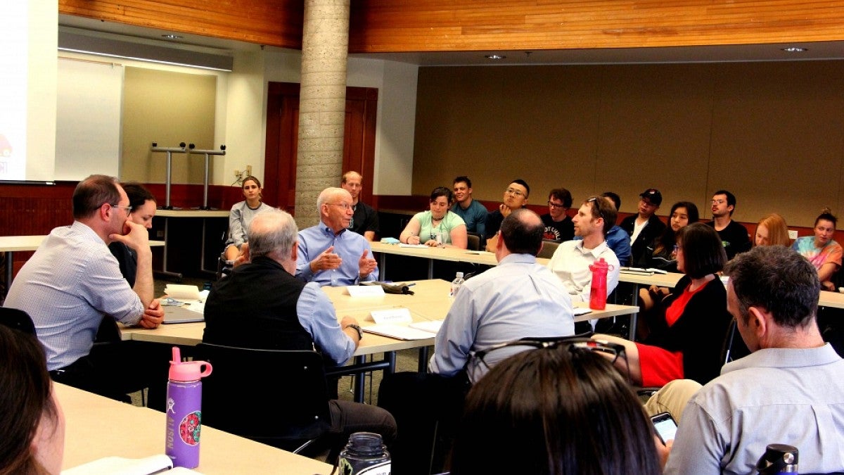 U.S. Rep. Peter DeFazio talks with UO faculty membes and students