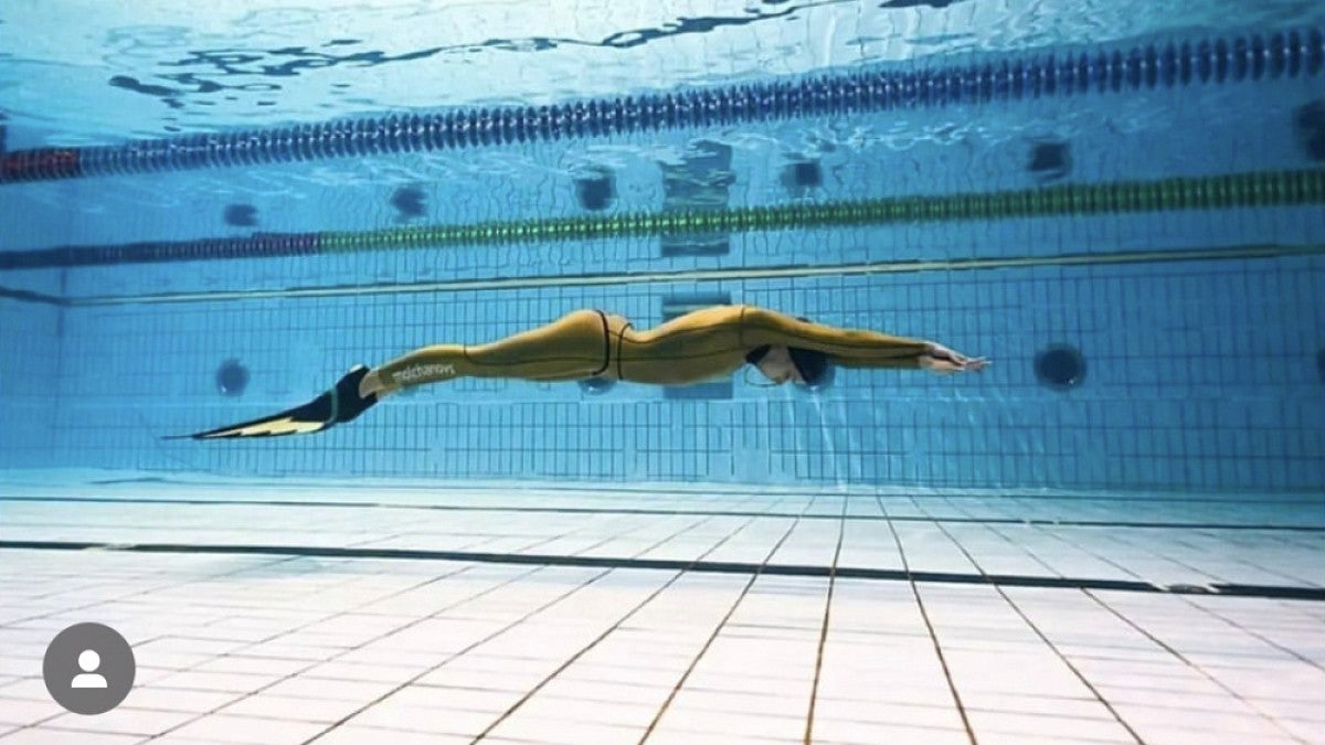 Swimmer underwater in pool