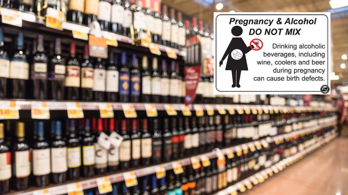 Image from a liquor store with an inset of Oregon's required signage that warns women to avoid alcohol while pregnant