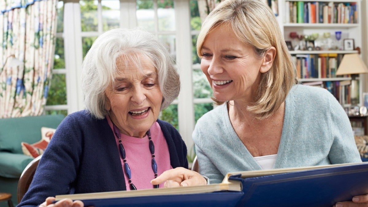 Older woman reading with daughter