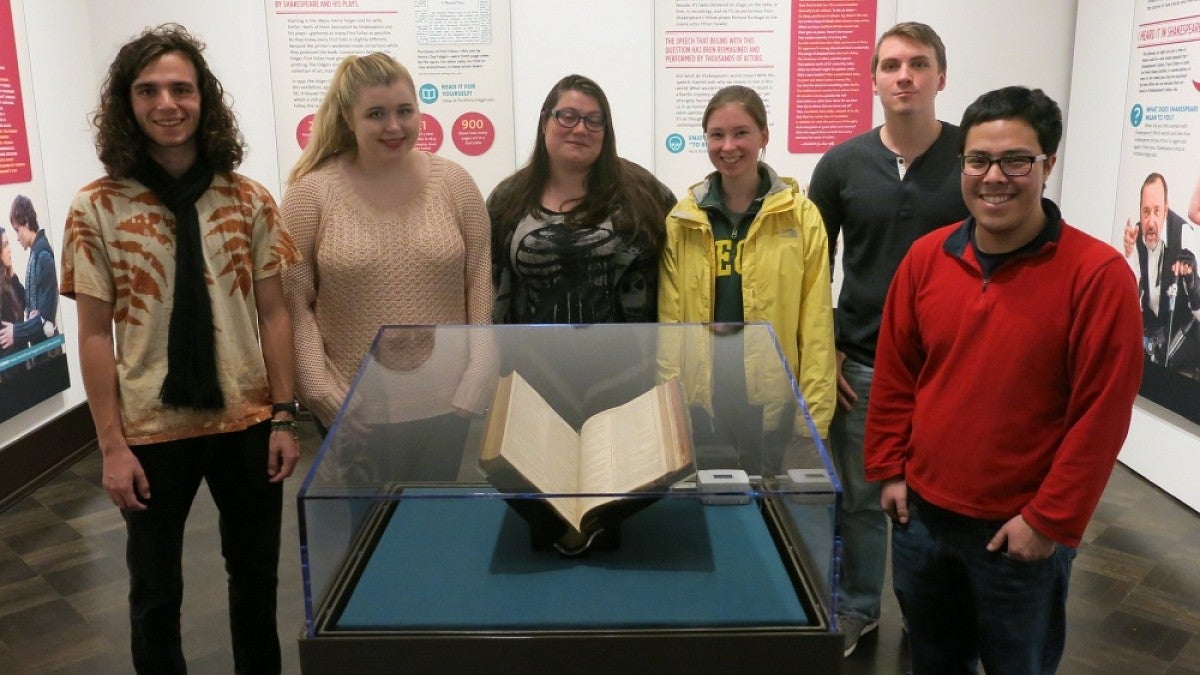 Members of the first Humanities Undergraduate Research Fellowships class visit the First Folio exhibit at the Jordan Schnitzer Museum of Art.