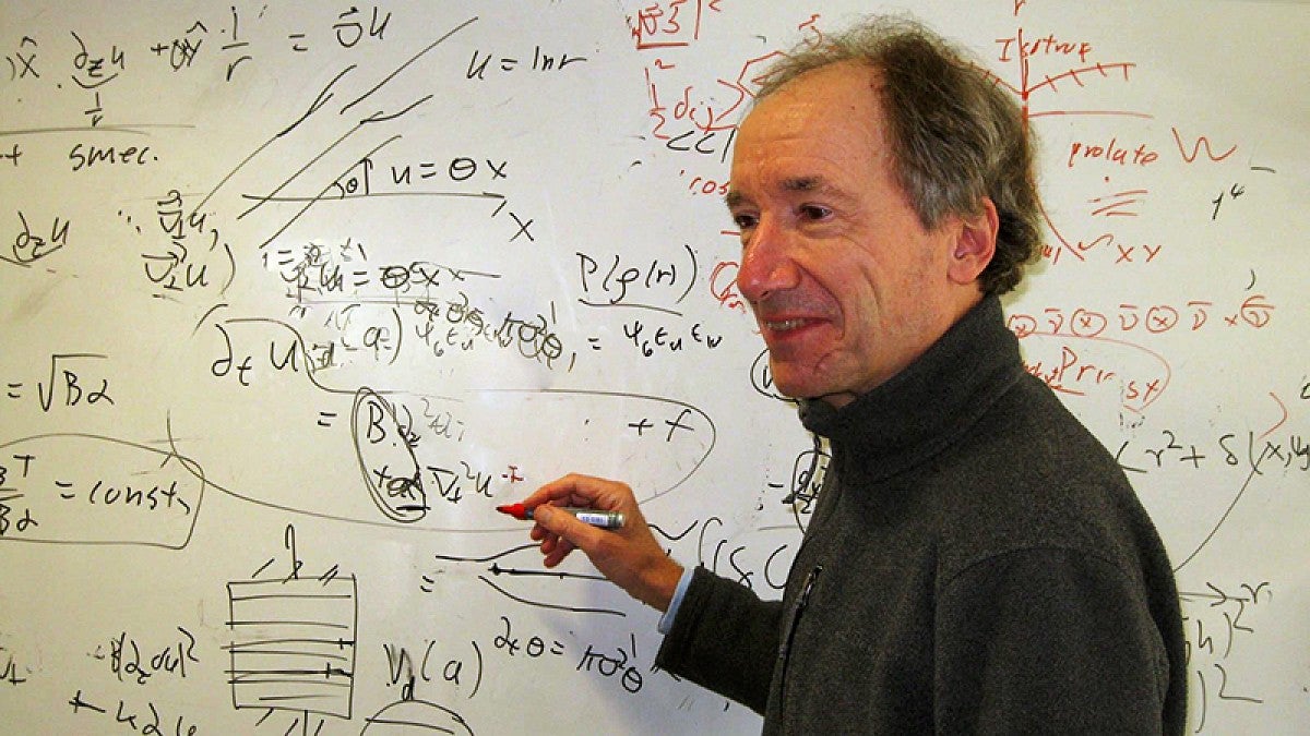 UO physicist John Toner works on an equation