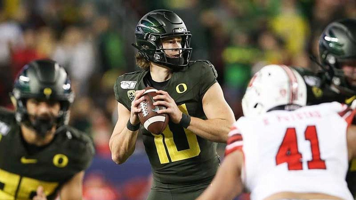 Justin Herbert during a pass play in the Pac-12 Championship Game