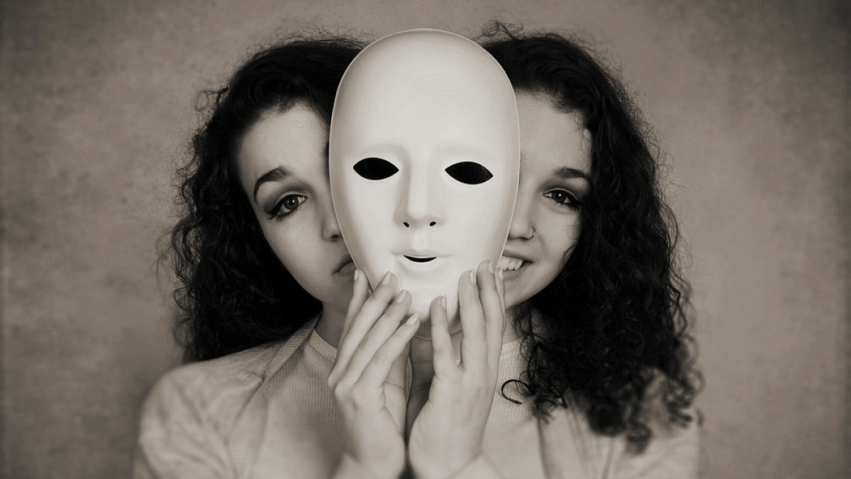 Woman holding face mask