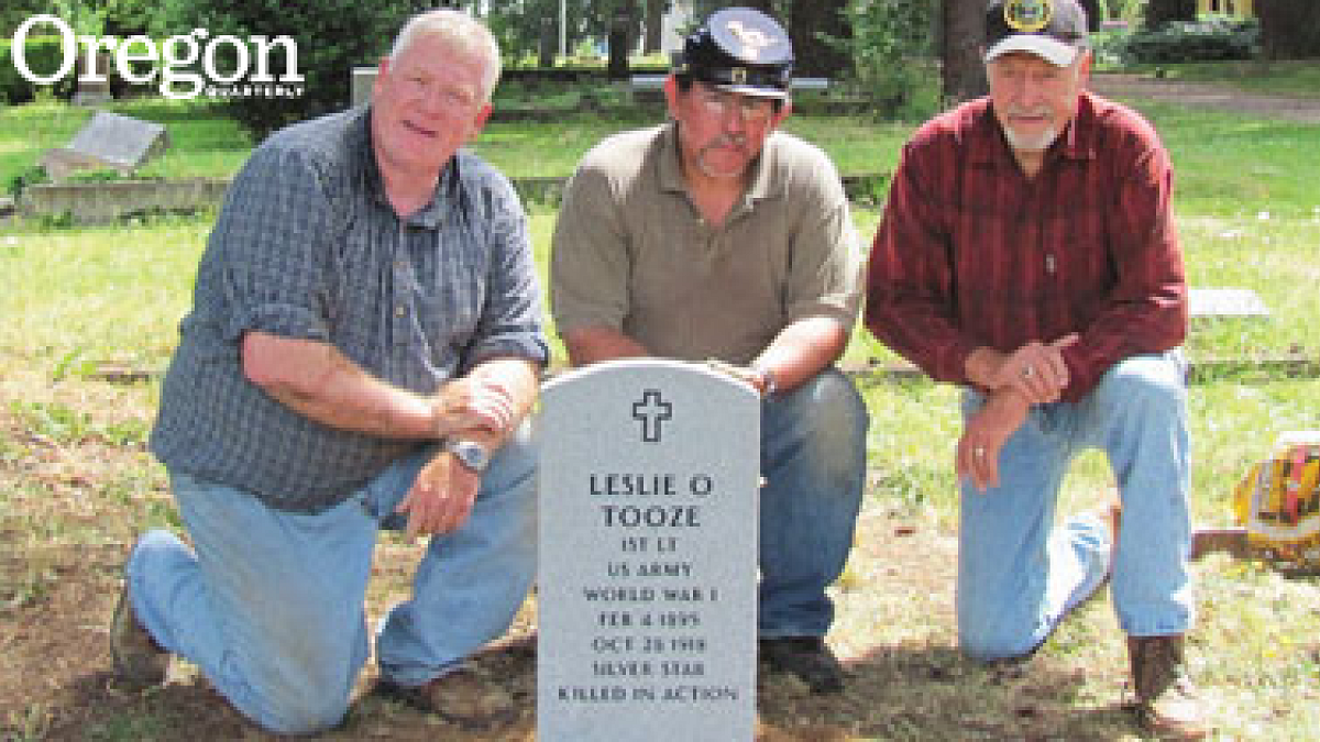 Doug Sebranek, Tony Pasillas, and Cabot Clark recently placed the gravestone of World War I casualty Leslie Tooze in Pioneer Cemetery. Photograph courtesy Quentin Holmes