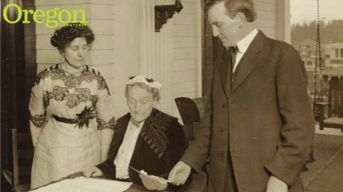 Abigail Scott Duniway signs Oregon's Equal Suffrage Proclamation on November 30, 1912, as Governor Oswald West and Viola M. Coe watch. Photograph courtesy Library of Congress 