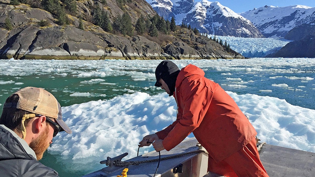 Dave Sutherland's team at work on boat at Alaskan glacier