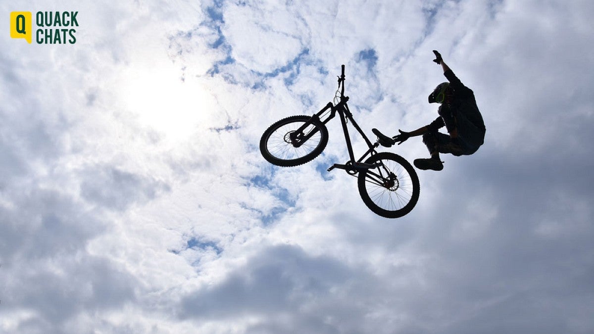 Teen doing bike acrobatics