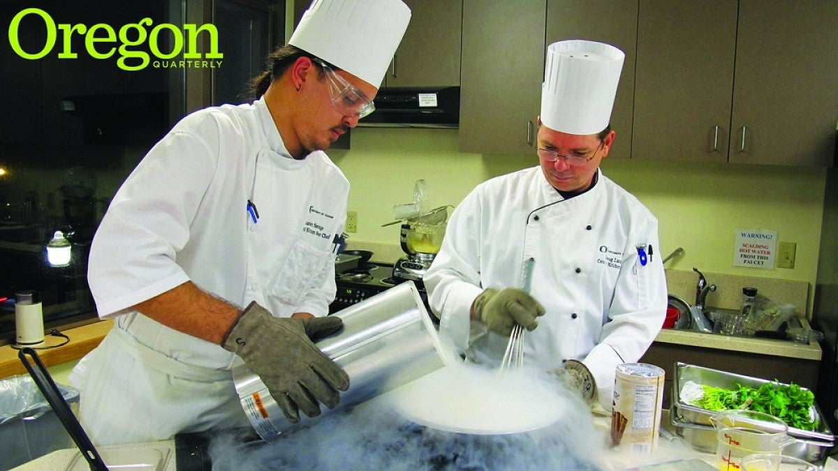 Sous chef Shawn Savage pours—195°C liquid nitrogen into a cream base as head chef Doug Lang whisks the mixture into a rich, flash-frozen dessert. Photograph by Ann Wiens