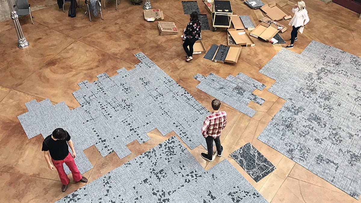 Possible layouts of fractal carpeting are being tested in Willamette Hall's Paul Olum Atrium