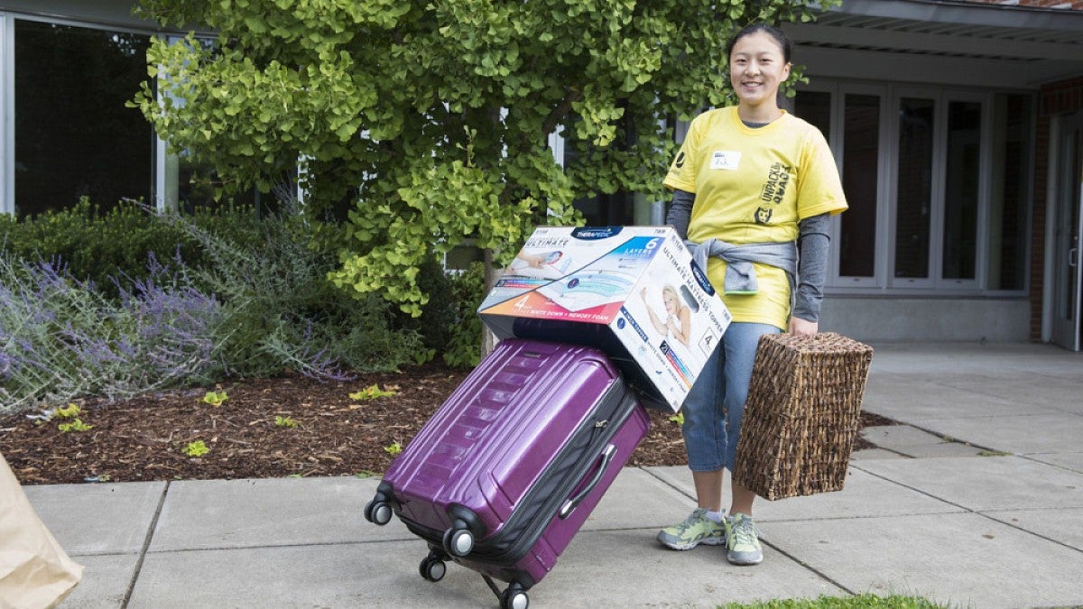 Volunteer helping with move-in