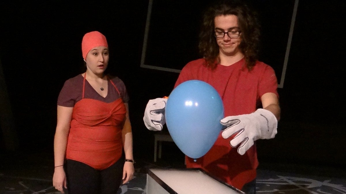 Students use a ballon in a science demonstration during rehearsals for 'Wonder if Wonder Why.'