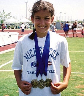 A young Jenna Prandini with her medals