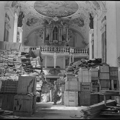 American soldier inspects German loot stored in a church at Elligen, Germany, April 24, 1945 (NARA #111-SC-204899)