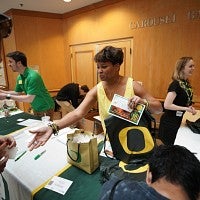 Handing out UO swag