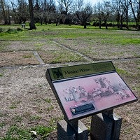 The original mission structure is no longer standing, but this interpretive sign at the Whitman Mission National Historical Site marks its location.