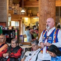 The delegation of elder men from the Confederated Tribes of the Umatilla Indian Reservation attends the June 3 event at Many Nations Longhouse. (L-R seated:  Andy DuMont, Les Minthorn, Woodrow Star, Phillip Cash Cash; standing: Tim Nitz)