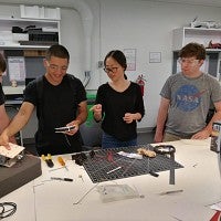 UO students collaborate to build a rover robot.