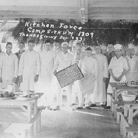 Group photo of kitchen staff in chef's whites